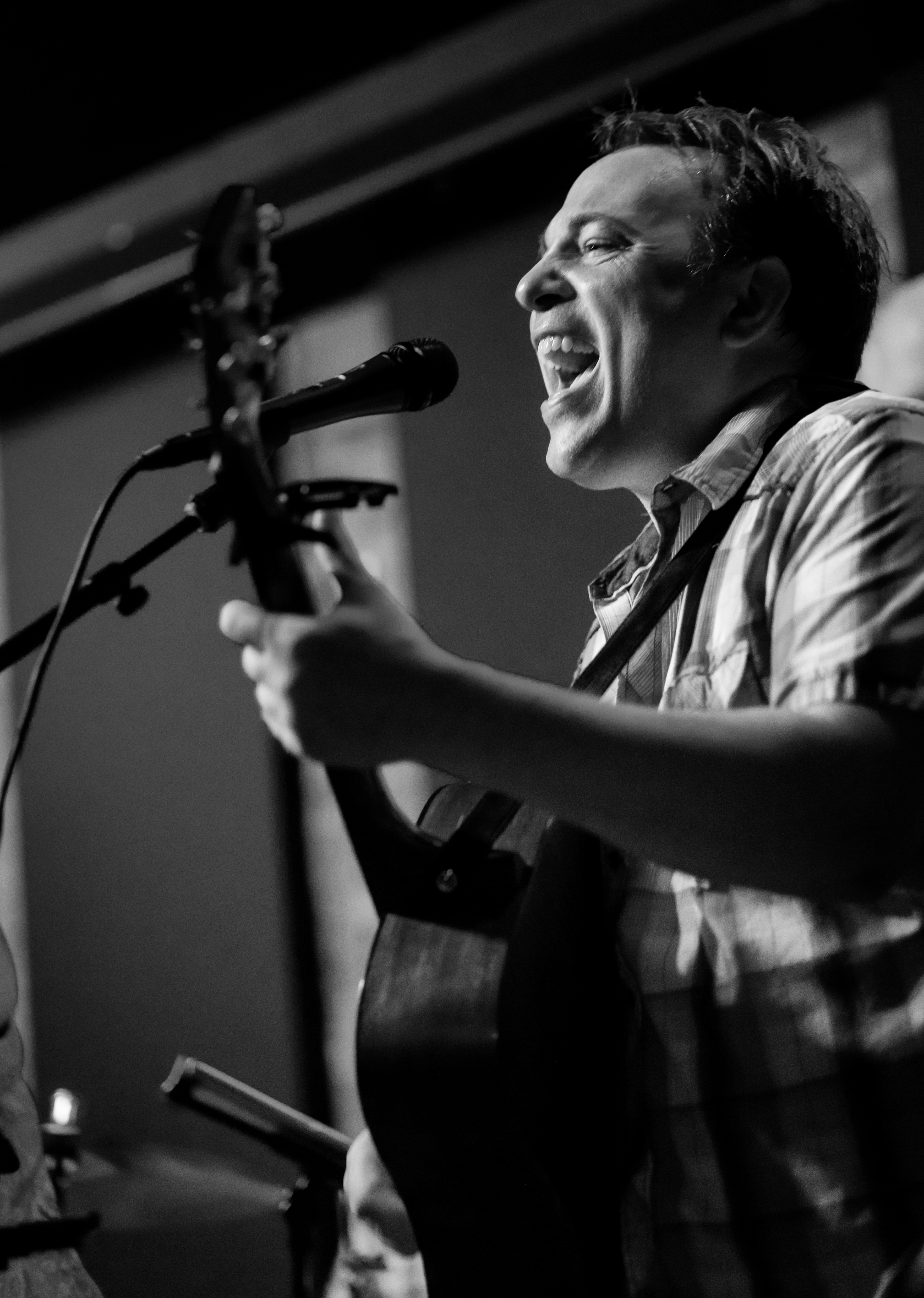 Chuck of Neighborhood Kids singing at a Chicago venue